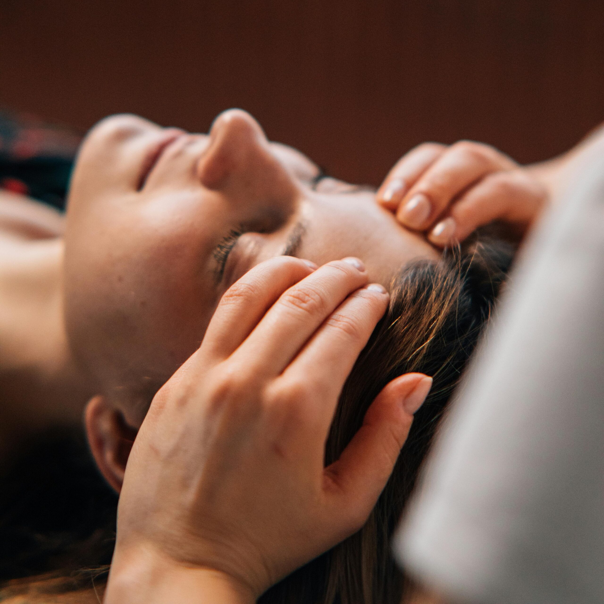 Close-up of a woman receiving a soothing massage at a spa for complete relaxation.